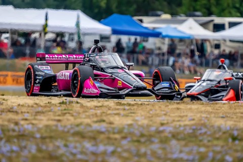 INDYCAR Series driver, HELIO CASTRONEVES (06) of Sao Paulo, Brazil, races through the turns during