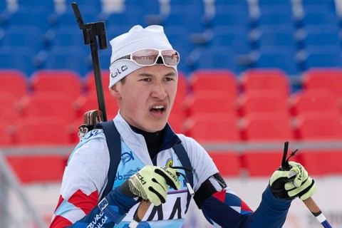 Portrait of Russian sportsman biathlete Ilmir Akhtyamov Saint Petersburg at finish after rifle