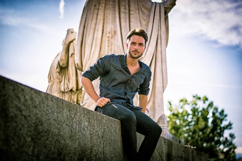 One handsome young man in urban setting in European city, Turin in Italy