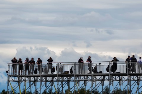 Spotters watch their drivers as they help them travel through traffic during the Bitnile.com Grand