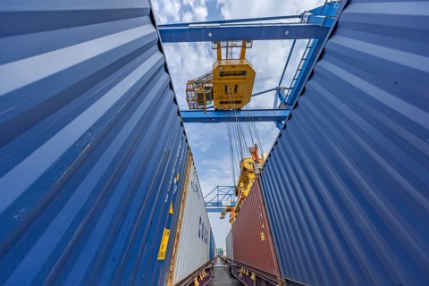 Crane loading containers onto a train in the Port of Duisburg, Terminal D3T, Logport l, Rhine,