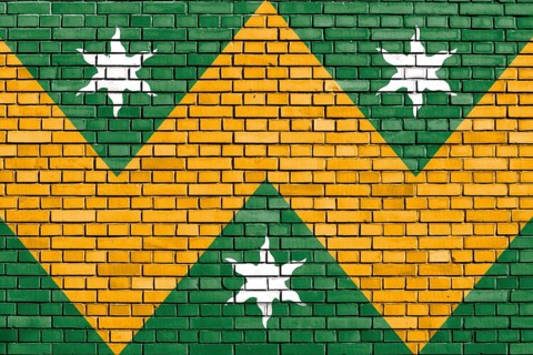 Flag of Wadhurst painted on brick wall
