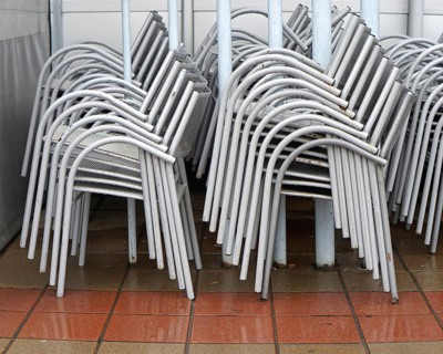 Packed stack of metal chairs