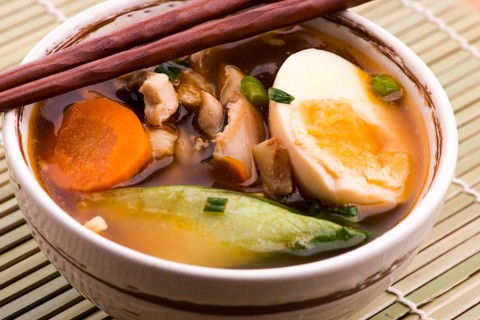 Ramen egg noodle soup dish with salmon fish