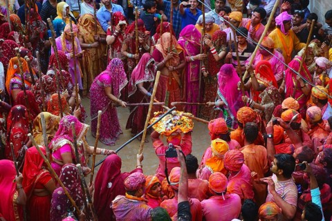 Women beating men with sticks, Lathmar Holi festival, Mathura, Uttar Pradesh, India, Asia