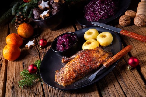 Roast goose with baked apples, red cabbage and dumplings