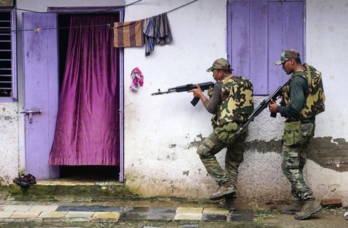 Force One commandos conduct a search and combing operation in a slum area of Uran, about 47 km East