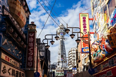 OSAKA, JAPAN - SEPTEMBER 26 2024: The famous Shinsekai area with Tsutenkaku Tower on a clear autumn