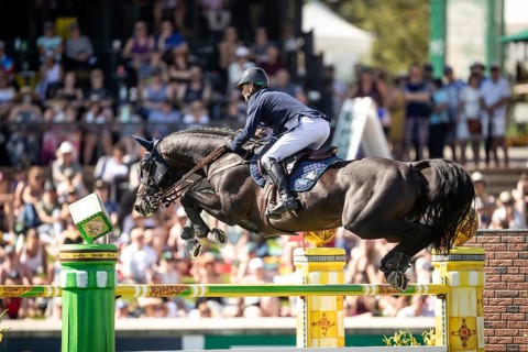 Denis Lynch of Ireland and riding Vistogrand compete in the first round of the 1.60m CPKC