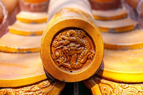 Close-up of resplendent glazed ornamental roof tiles on an imperial palace in Beijing, China in