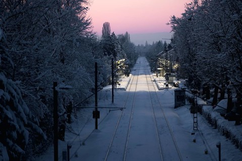 Railway tracks and surroundings covered with snow under winter sun, Allensbach, Lake Constance,