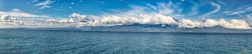 Garda Lake coast on a sunny day with beautiful clouds