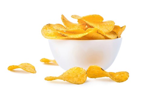 Potato chips in a bowl isolated on a white background