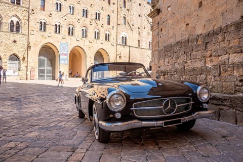 VOLTERRA, ITALY, OCTOBER 15, 2023, A Mercedes Benz 190SL vintage car in the town center of Volterra