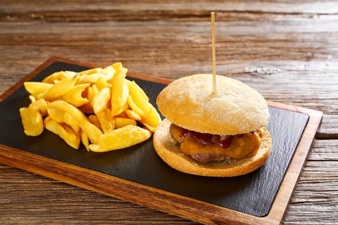 Burguer and french fries potato chips on wood table