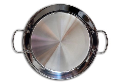 Paella pan in stainless steel on white background