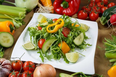 Healthy eating background. Different vegetables and salad with leaf vegetables and cherry tomatoes