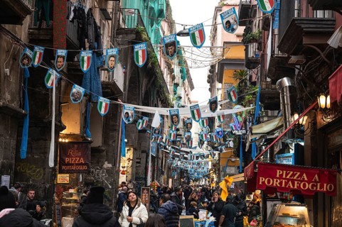 NAPLES, ITALY - JANUARY 14, 2024: A street with the pennants of the football team FC Napoli, the