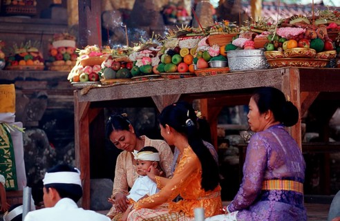 Woman with offerings in Hindu temple Ubud, Indonesia, Bali, Ubud, Asia