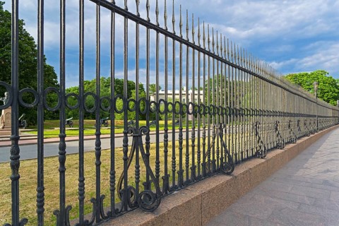 Old forged metal fence at the Museum of Artillery. Kronverkskaya Embankment, Saint Petersburg,
