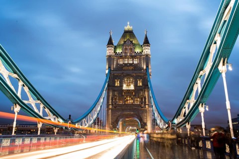 London Tower bridge on sunset illuminated with different colors