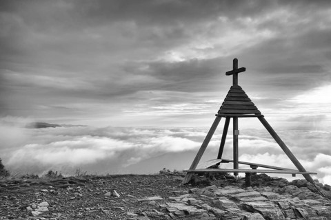 Wooden monument in Gerlitzen Apls, Austria. Inverse weather