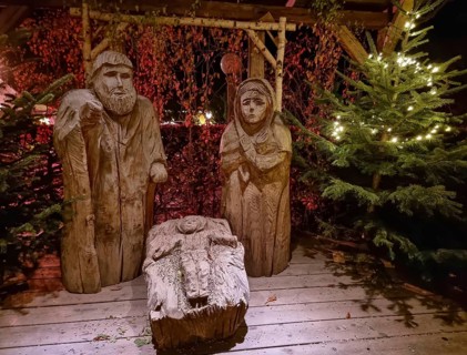 Traditional Christmas nativity scene with figures made out of wood, the birth of Jesus Christ in