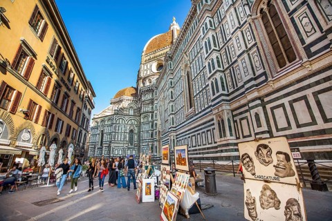 Florence Tuscany Italy on September 30, 2019 Artists exhibit paintings in front of the Duomo in