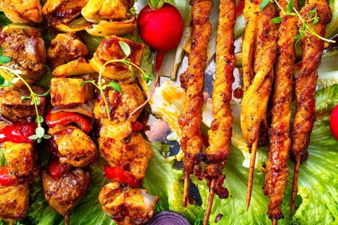 Grilled szaszlyk and meatballs with green salad