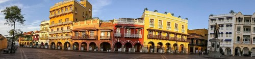 Panorama of an ensemble of colorful historic buildings on a sunny day in Cartagena, Colombia,