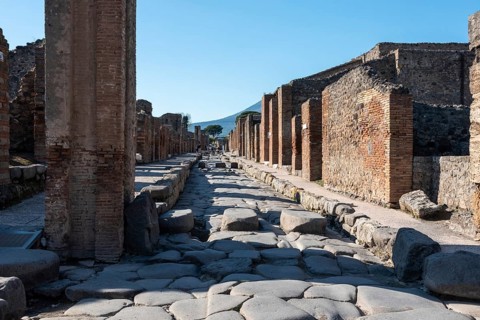 POMPEII, ITALY, MAY 04, 2022, A crosswalk of a typical Roman road in the ancient city of Pompeii,