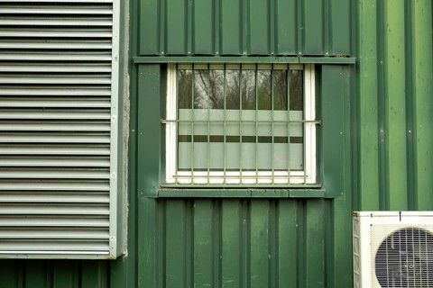 Old office building with windows and air conditioning