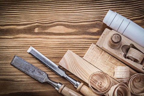 Engineering drawing planer chisels wooden bricks shavings on wood board