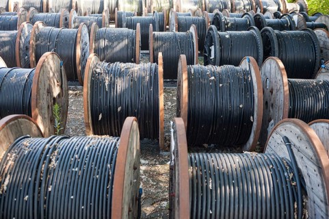 14.06.2017, Berlin, Germany, Europe, Black underground cables for the power supply are wound onto