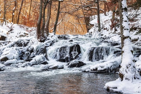 Selke waterfall near Alexisbad in the Selke valley Harz in winter with ice and snow