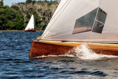 Classic sailing yacht sailing on a lake during a regatta