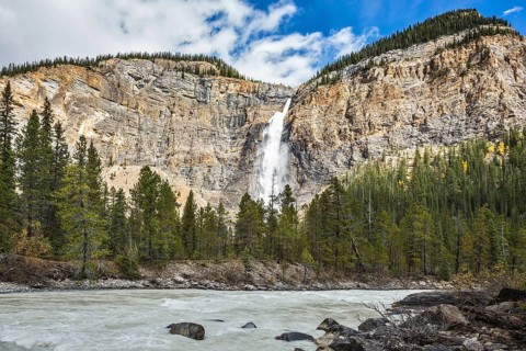 Sunny autumn day in Yoho National Park in the Rocky Mountains of Canada. Colossal Takakkaw
