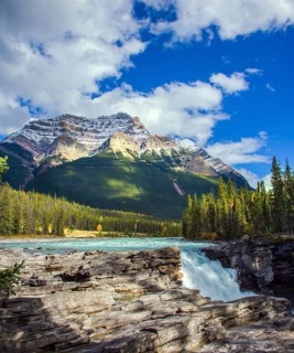 The magnificent powerful Athabasca Falls, popular with tourists. Rocky Mountains of Canada. The