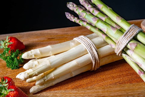Green and white asparagus on the table