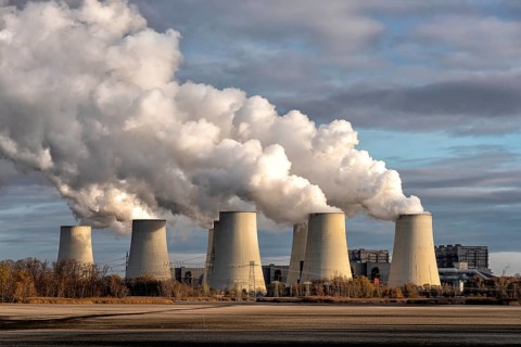 Towers of a power plant in Germany with huge clouds of exhaust fumes