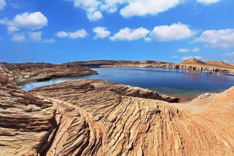 Bright blue water bay. Bottling magnificent Lake Powell photographed by Fisheye lens