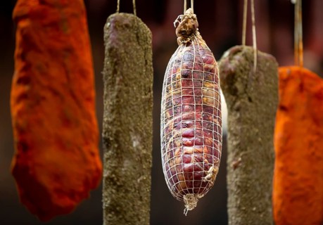 Dried green, brown and orange beef and pork jerky is shown at a food and drink exhibition