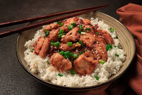 Fried chicken teriyaki with rice, green onion and sesame, homemade, no people