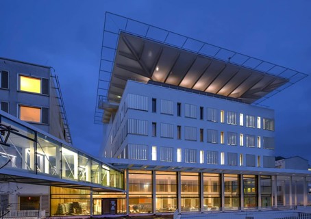 New construction of the University Hospital for Surgery with helicopter landing pad, dusk,