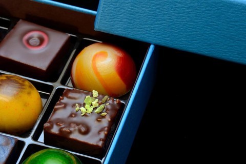 Chocolates in box, black background