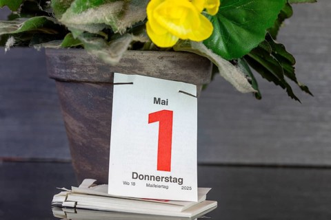 May Day: The page of a tear-off calendar shows the date 1 May