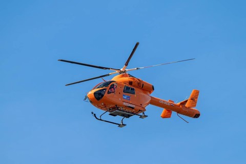 Rescue helicopter, emergency helicopter in flight, Schwaz, Tyrol, Austria, Europe