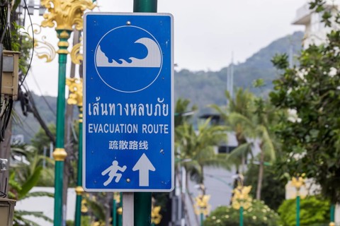 Tsunami Hazard Zone. Warning sign, signposting of escape routes in the event of another seaquake.