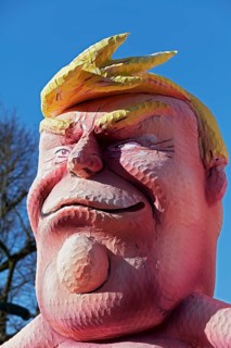 US President Donald Trump, head with yellow quiff, papier-mâché figure, Jacques Tilly theme float,