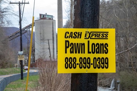 Lynch, Kentucky - A pawn shop advertises near coal mining equipment that remains in a former U.S.
